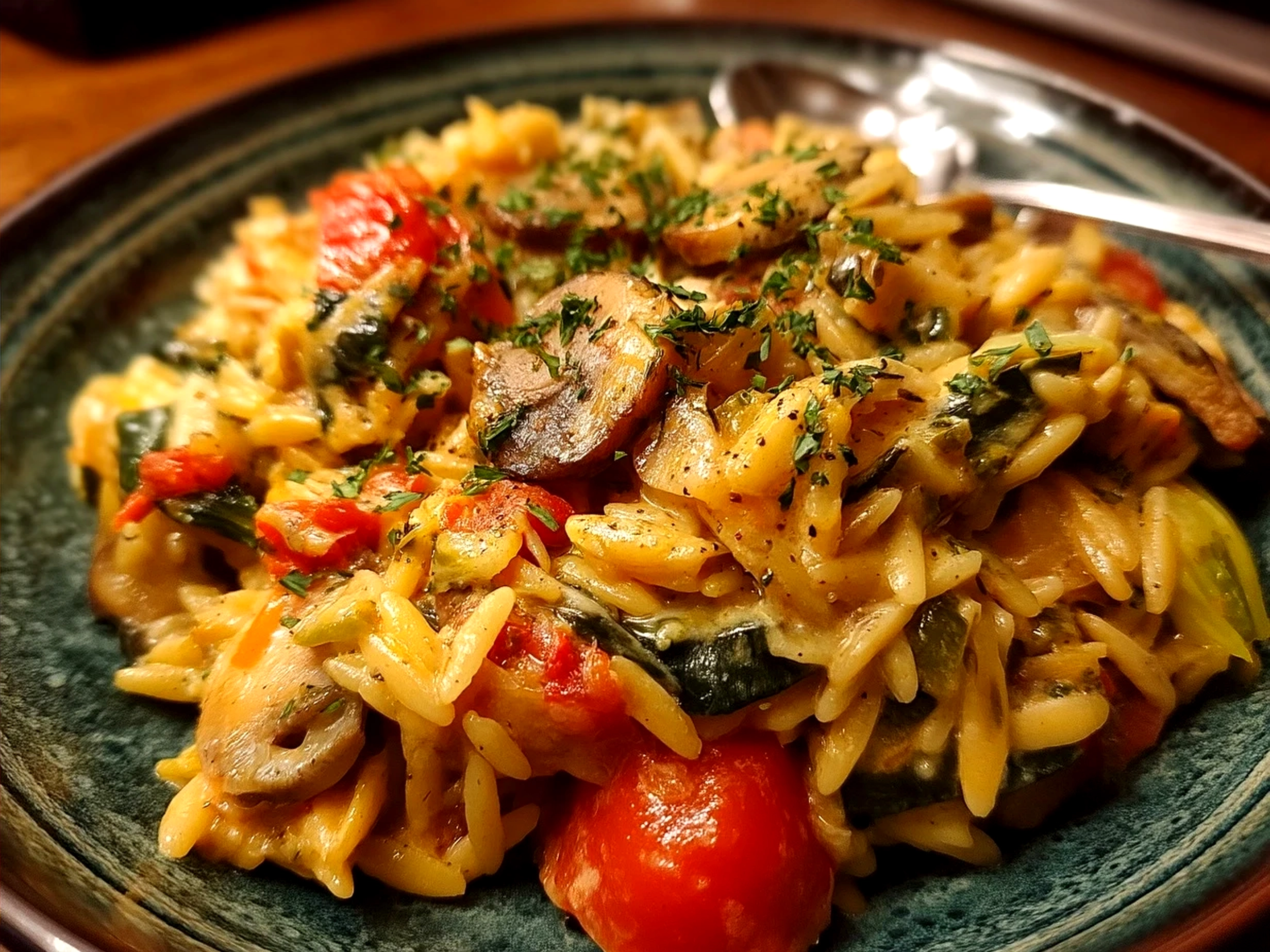 Finished One-Pot Veggie Cream Orzo served and garnished with fresh herbs and Parmesan