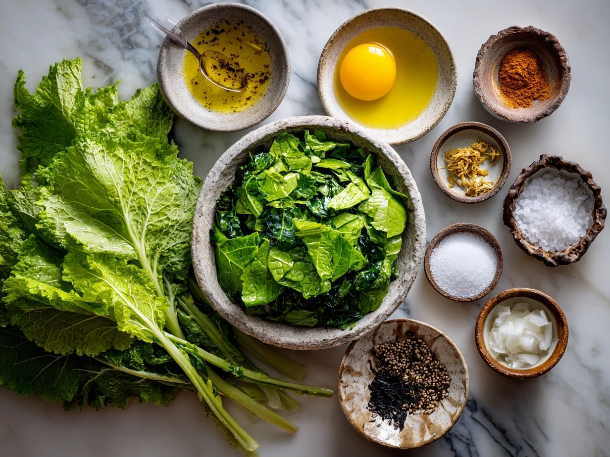 Ingredients for Southern turnip greens recipe including turnip greens, smoked ham hock, onion, garlic, broth, and seasonings